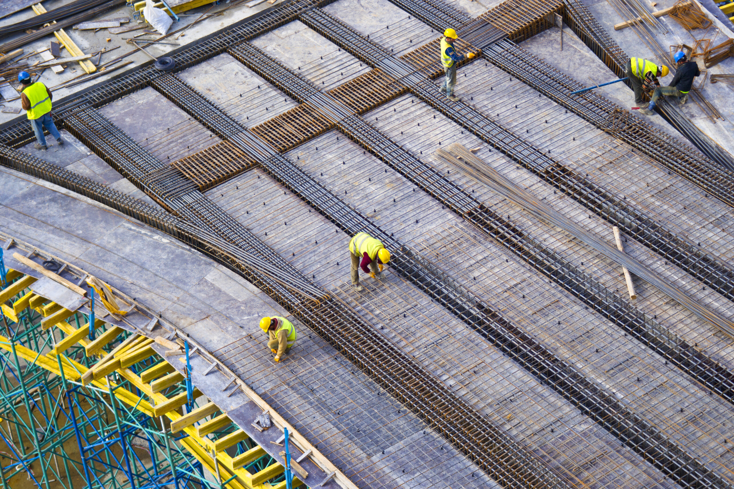 Precast concrete panels being lifted and installed on construction site
